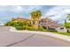 Beautiful clubhouse with multiple floors, terracotta roofs, and lush greenery, offering luxurious amenities and spaces at 6648 S Lyon Dr, Gilbert, AZ 85298