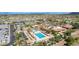 Aerial view of community pool, tennis courts, and recreation center showcasing resort-style amenities at 6648 S Lyon Dr, Gilbert, AZ 85298