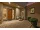 Inviting front porch featuring a cozy seating area, decorative windows, and a well-maintained brick paver walkway at 6648 S Lyon Dr, Gilbert, AZ 85298