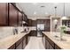 Large kitchen featuring tile floors, granite counters, mosaic backsplash, and stainless appliances at 6648 S Lyon Dr, Gilbert, AZ 85298