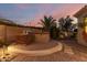 Outdoor kitchen featuring stainless steel BBQ grill with stone accents and paved patio area at 6648 S Lyon Dr, Gilbert, AZ 85298