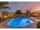 Inviting pool with a spa and lush landscaping, perfect for outdoor relaxation at 6648 S Lyon Dr, Gilbert, AZ 85298