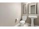 Elegant powder room featuring pedestal sink, modern fixtures, and tiled flooring at 6648 S Lyon Dr, Gilbert, AZ 85298