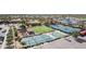 Aerial shot showcases a tennis and pickleball courts, with other recreation areas and ample parking at 6648 S Lyon Dr, Gilbert, AZ 85298