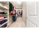 This walk-in closet offers ample hanging and shelving space, perfect for organization at 6648 S Lyon Dr, Gilbert, AZ 85298