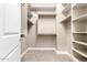 Spacious walk-in closet with custom shelves and ample storage at 6648 S Lyon Dr, Gilbert, AZ 85298