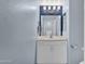 Charming half bathroom with white vanity, stylish mirror, and decorative lighting at 6745 N 93Rd Ave # 1158, Glendale, AZ 85305
