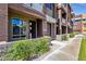 Modern townhome exterior showcasing multi-tone stucco, balconies, and well-maintained landscaping at 6745 N 93Rd Ave # 1158, Glendale, AZ 85305