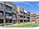 A multi-unit home featuring desert landscaping, balconies and earth tone colors at 6745 N 93Rd Ave # 1158, Glendale, AZ 85305