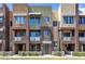 Modern townhome exterior showcasing multi-tone stucco, balconies, and well-maintained landscaping at 6745 N 93Rd Ave # 1158, Glendale, AZ 85305