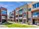 Modern townhome exterior showcasing multi-tone stucco, balconies, and well-maintained landscaping at 6745 N 93Rd Ave # 1158, Glendale, AZ 85305