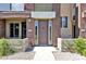 Front entrance of a multi-unit house featuring desert landscaping, awning, and earth tone colors at 6745 N 93Rd Ave # 1158, Glendale, AZ 85305