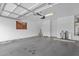 Clean and spacious garage with ample room for parking and storage, featuring bright lighting and a water heater at 6745 N 93Rd Ave # 1158, Glendale, AZ 85305