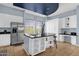 Modern kitchen with stainless steel appliances, a large island, and stylish lighting at 6745 N 93Rd Ave # 1158, Glendale, AZ 85305