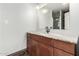 Bathroom featuring a modern vanity with marble countertop, a framed mirror, and stylish pendant lighting at 725 S Power Rd # 101, Mesa, AZ 85206