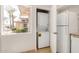 Kitchen featuring stacked washer and dryer, modern appliances, and bright window views at 725 S Power Rd # 101, Mesa, AZ 85206