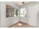 Cozy room featuring tiled floor, neutral paint, and windows with a neighborhood view at 725 S Power Rd # 101, Mesa, AZ 85206