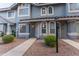 Charming townhome exterior with stucco facade, tiled roof, and inviting walkway at 860 N Mcqueen Rd # 1151, Chandler, AZ 85225
