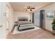 Comfortable bedroom boasting a ceiling fan, plush carpet and a queen sized bed at 860 N Mcqueen Rd # 1151, Chandler, AZ 85225