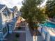 Aerial view of condos, mature trees and community pool, plus well maintained landscaping at 860 N Mcqueen Rd # 1151, Chandler, AZ 85225