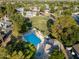 Aerial view of a community pool and common area with mature trees and landscaping at 860 N Mcqueen Rd # 1151, Chandler, AZ 85225