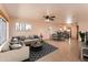 Open floor plan featuring living, dining and kitchen area, with tiled flooring and neutral decor at 860 N Mcqueen Rd # 1151, Chandler, AZ 85225