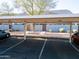 Assigned covered parking spaces with privacy walls between units and landscaped ground cover at 860 N Mcqueen Rd # 1151, Chandler, AZ 85225
