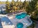An aerial view of a large sparkling pool with a hot tub and lounging chairs at 860 N Mcqueen Rd # 1151, Chandler, AZ 85225