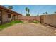 A large backyard with patio and gravel area, blending natural beauty and outdoor living at 9106 N 68Th Ln, Peoria, AZ 85345