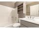 Bathroom with a tub-shower combo, a vanity, and a mirrored medicine cabinet at 9106 N 68Th Ln, Peoria, AZ 85345