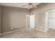 Bedroom featuring a white door and light wood-look floors, blending comfort and style at 9106 N 68Th Ln, Peoria, AZ 85345