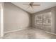 Neutral bedroom with a ceiling fan and wood-look tile flooring, creating a serene space at 9106 N 68Th Ln, Peoria, AZ 85345