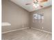 This bedroom features a ceiling fan and a large window providing natural light at 9106 N 68Th Ln, Peoria, AZ 85345