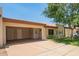 Charming single-story home featuring an open carport and well-maintained front yard landscaping at 9106 N 68Th Ln, Peoria, AZ 85345