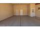 Spacious garage with multiple access points, providing convenience and ample storage space at 9106 N 68Th Ln, Peoria, AZ 85345