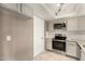 This is a kitchen with stainless steel appliances and white shaker style cabinets at 9106 N 68Th Ln, Peoria, AZ 85345