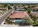Aerial view showcasing the property's pool, patio, and lush landscaping in a suburban neighborhood at 10152 E Aster Dr, Scottsdale, AZ 85260