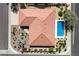 Bird's eye view showcases the property's roof, pool, landscaping, and proximity to the street at 10152 E Aster Dr, Scottsdale, AZ 85260