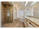 Elegant bathroom featuring a glass-enclosed shower and a luxurious soaking tub at 10152 E Aster Dr, Scottsdale, AZ 85260