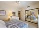 Inviting bedroom with a large mirrored closet and neutral décor at 10152 E Aster Dr, Scottsdale, AZ 85260