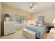 Charming bedroom with a ceiling fan and plantation shutters at 10152 E Aster Dr, Scottsdale, AZ 85260
