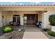 Charming front porch with seating, decorative accents, and decorative metal doors at 10152 E Aster Dr, Scottsdale, AZ 85260
