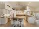 Well-lit kitchen features a granite island, breakfast bar, and stainless steel appliances at 10152 E Aster Dr, Scottsdale, AZ 85260