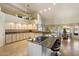 Well-appointed kitchen with bar seating at the island and many upper cabinets for storage at 10152 E Aster Dr, Scottsdale, AZ 85260