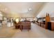 Spacious living room with ample seating, high ceilings, and views to outdoor area at 10152 E Aster Dr, Scottsdale, AZ 85260