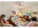 Living room with a ceiling fan, comfortable seating, and natural light at 10152 E Aster Dr, Scottsdale, AZ 85260