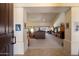 Open-concept living room featuring high ceilings, neutral tones, and seamless flow to dining and other spaces at 10152 E Aster Dr, Scottsdale, AZ 85260