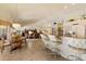 Open-concept living space featuring a breakfast bar, dining area, and living room with vaulted ceilings at 10152 E Aster Dr, Scottsdale, AZ 85260