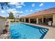Sparkling pool with tile trim and easy access from covered patio and house at 10152 E Aster Dr, Scottsdale, AZ 85260