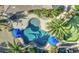 Aerial view of a private backyard showcasing a sparkling pool and putting green at 1078 W Desert Aster Rd, San Tan Valley, AZ 85143